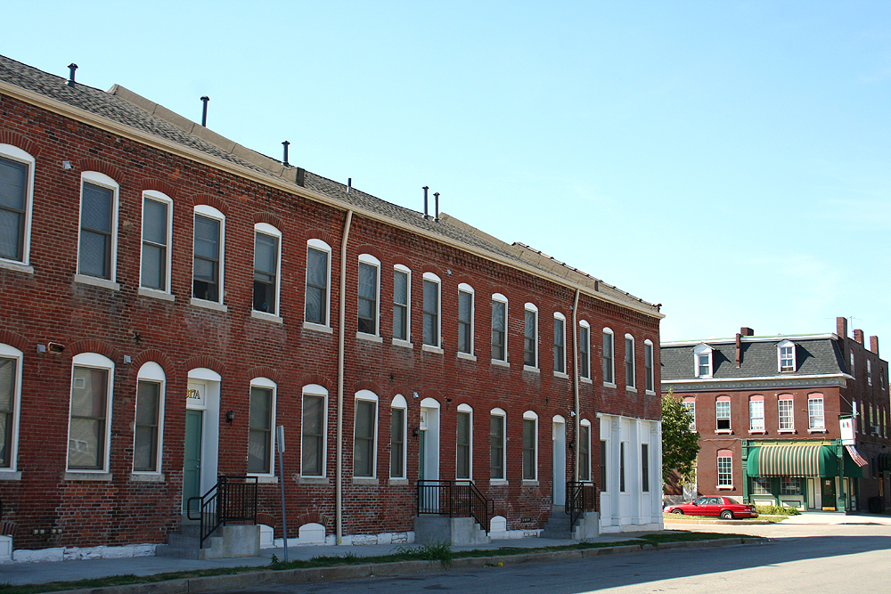 Historic brick row houses along a residential street in Old North Saint Louis.